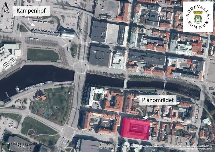 Flygfoto över ett tätbebyggt område med en skylt som pekar mot ”Kampenhof” och en annan mot ”Planområdet”.